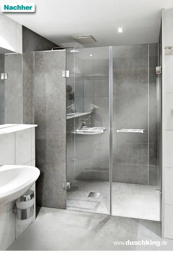 Nachher: bodengleiche Dusche mit Glaswand und fugenlosen Platten in Steinoptik